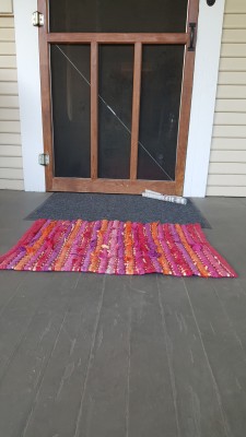 Living the Dream: Porch Makeover on a Budget:  The front door newspaper