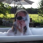 Bathing in our outdoor, clawfoot garden/vineyard tub.