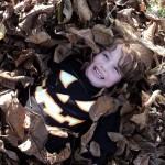 Boy in leaves