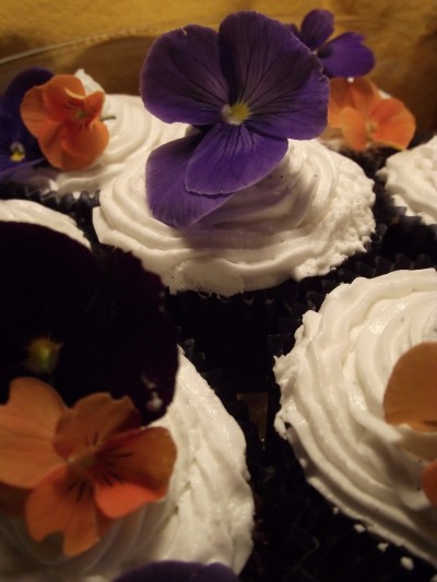 Devil's food cupcakes with vanilla bean frosting and edible garden flowers