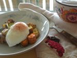 Poached egg on roasted veg with turkey sausage.
