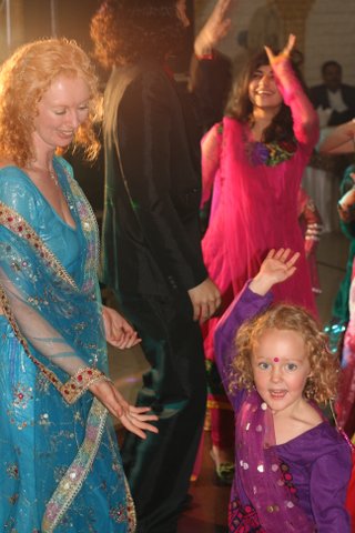 Natasha and Sofia dancing at an Indian wedding