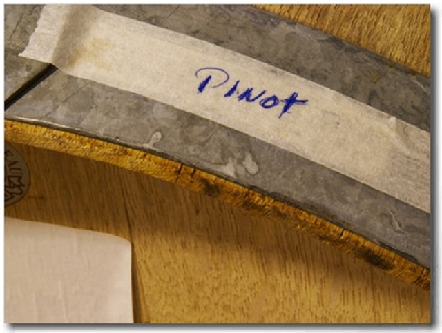 Bottling Pinot Noir: Detail of Oak Barrel with Pinot Noir by Per Karlsson