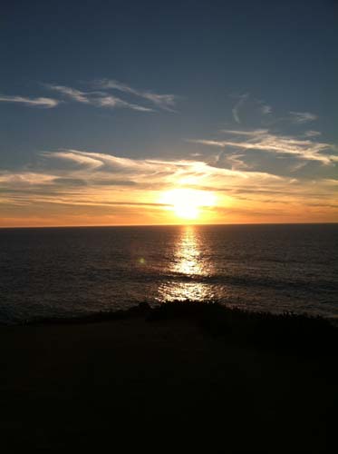 Developing Dreams looking at a sunset over the water on the Pacific coast