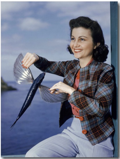 Worst Products: Woman Poses for a Photo with a Flying Fish in Her Hands buy at Art.com
