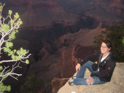 Katie sitting on the edge of the grand canyon